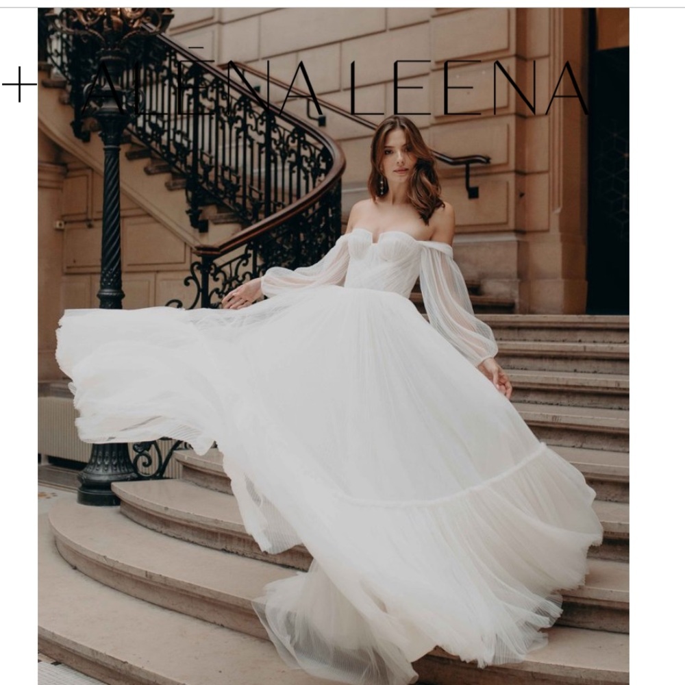 Brand new unaltered Alena Leena Armeria wedding dress in blush with sleeves